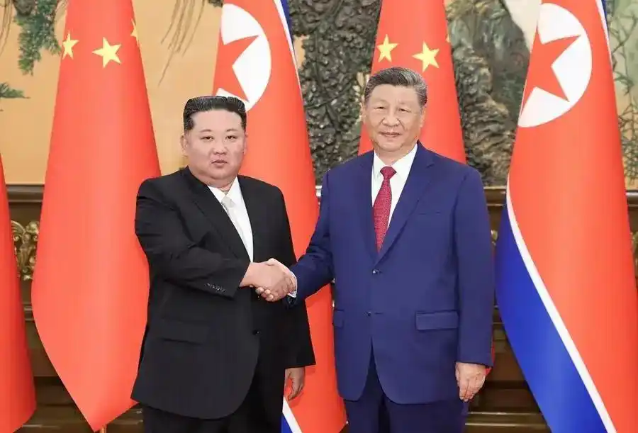 习近平金正恩会谈_中朝关系发展_习近平同金正恩会谈
